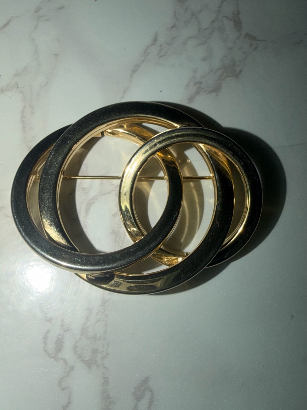 Gold and Black Interlocked Circle Brooch – Classic Women's Jewelry